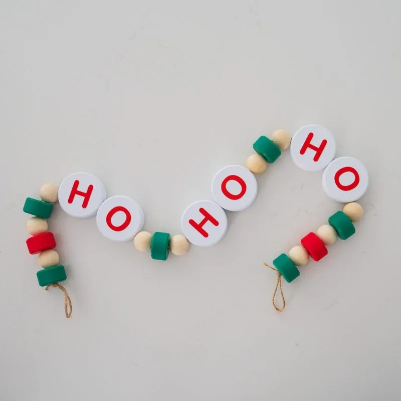 Wood bead garland with lettered beads spelling ho ho ho
