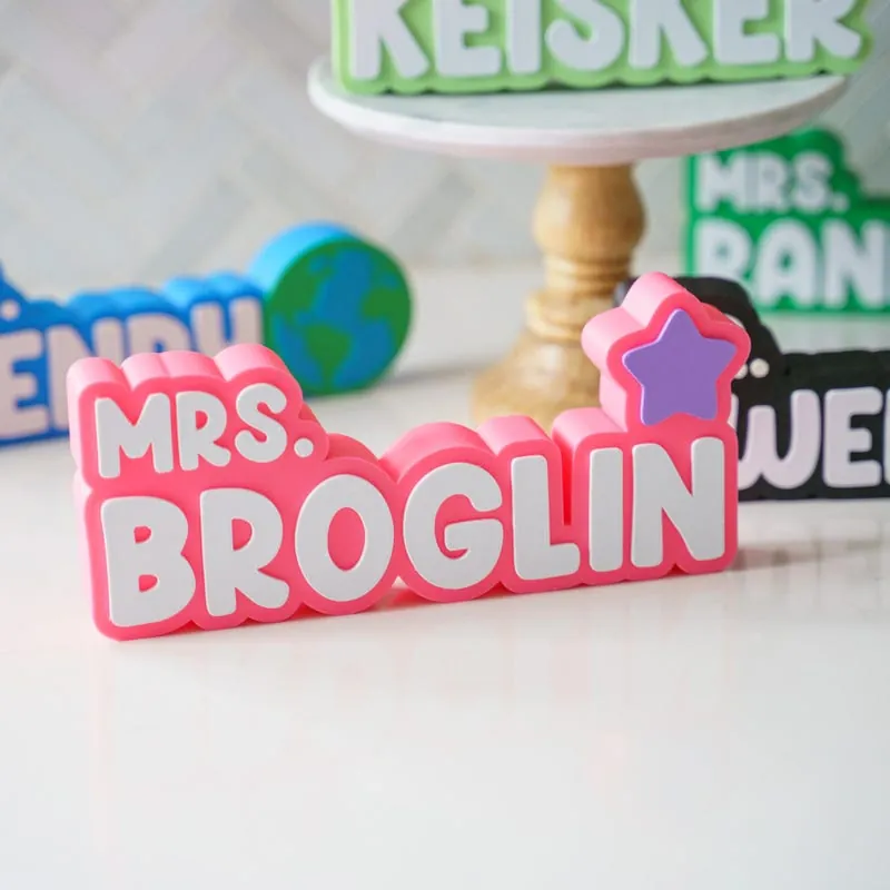 Pink custom nameplate that reads Mrs. Broglin